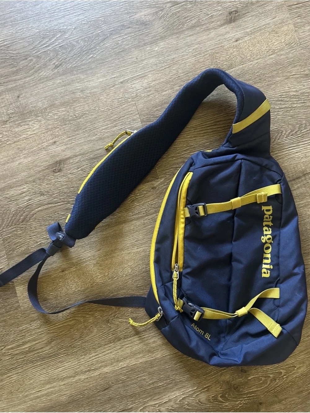 Patagonia navy and yellow sling belt bag
